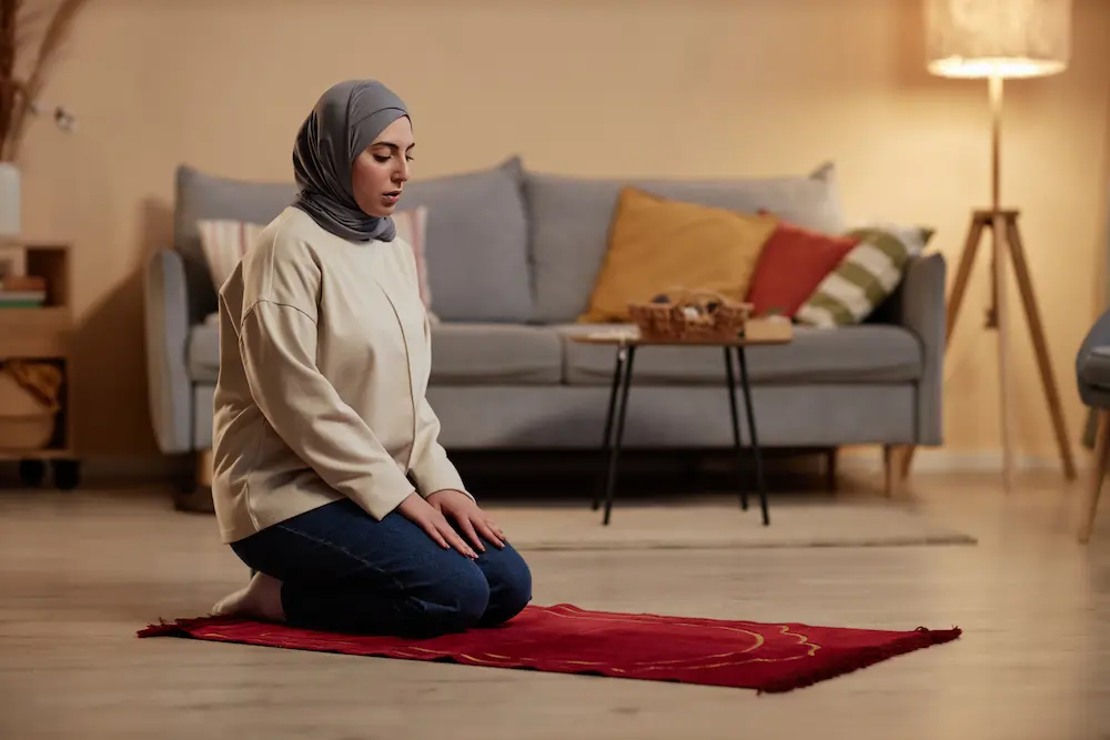 Muslim girl praying in modest but modern wear