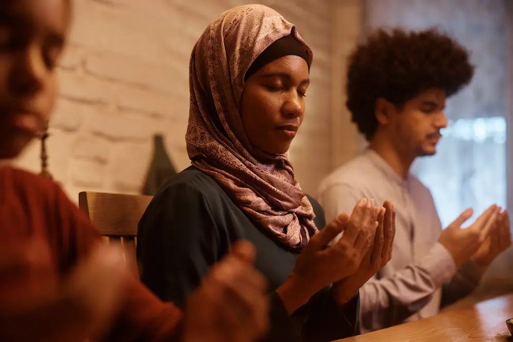 Young middle east woman wearing hijab with her brothers