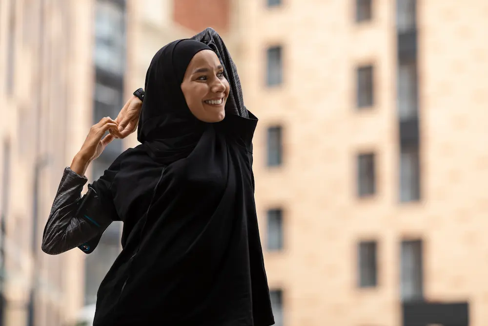 Smiling woman in Black hijab