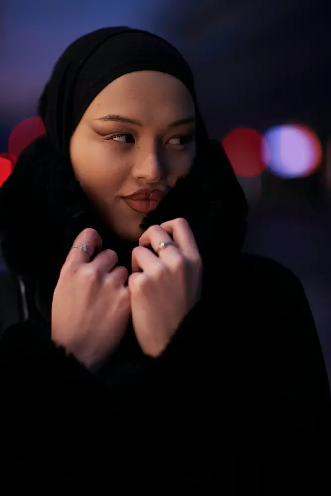 Woman in black hijab and makeup